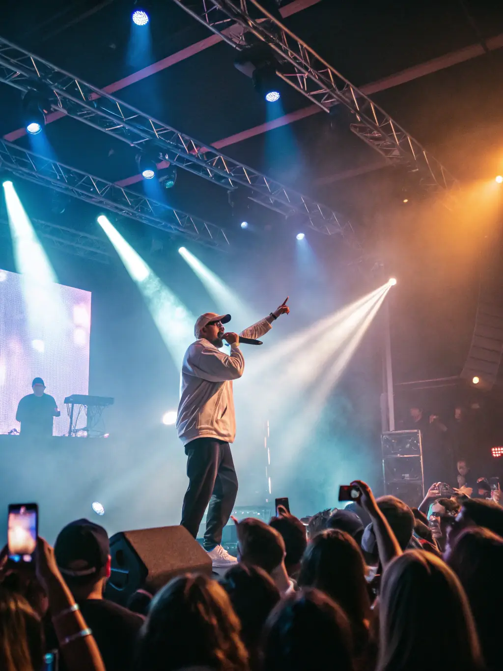 An image of a vibrant live performance event with a bustling audience and stage setup, representing ACPR's event management and promotion services.